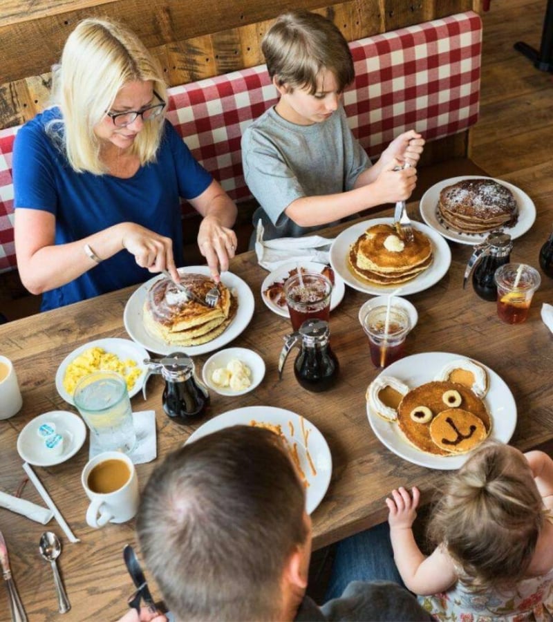 A family enjoying a breakfast feast.