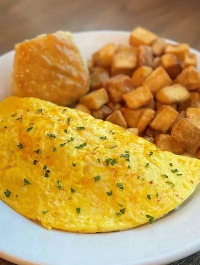 omelet and potatoes on plate